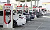 Kettleman City, CA - Jan 29, 2022: Many cars charging at a Tesla Supercharger station. Supercharger stations allow Tesla cars to be fast-charged at the network within a hour.