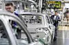 Body-shop Wolfsburg plant: An employee assembles the hood of a T