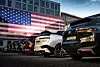 US Tariffs on German Cars - BMW cars in front of an American flag