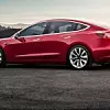 red-tesla-model-3-sunset-e1549437553845